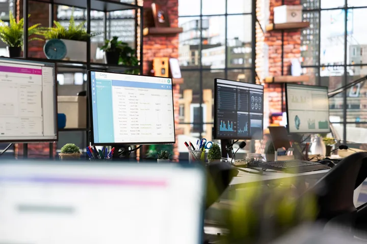 A modern product workspace with multiple screens