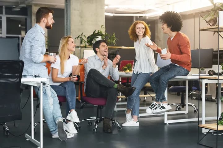 Colleagues sharing a light moment in a modern office